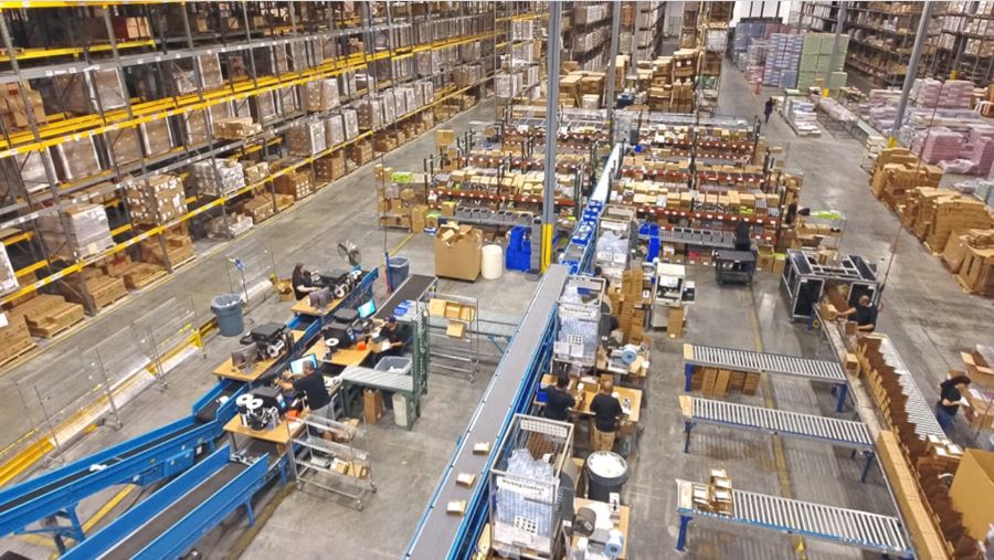 Fulfillment center packing stations and storage